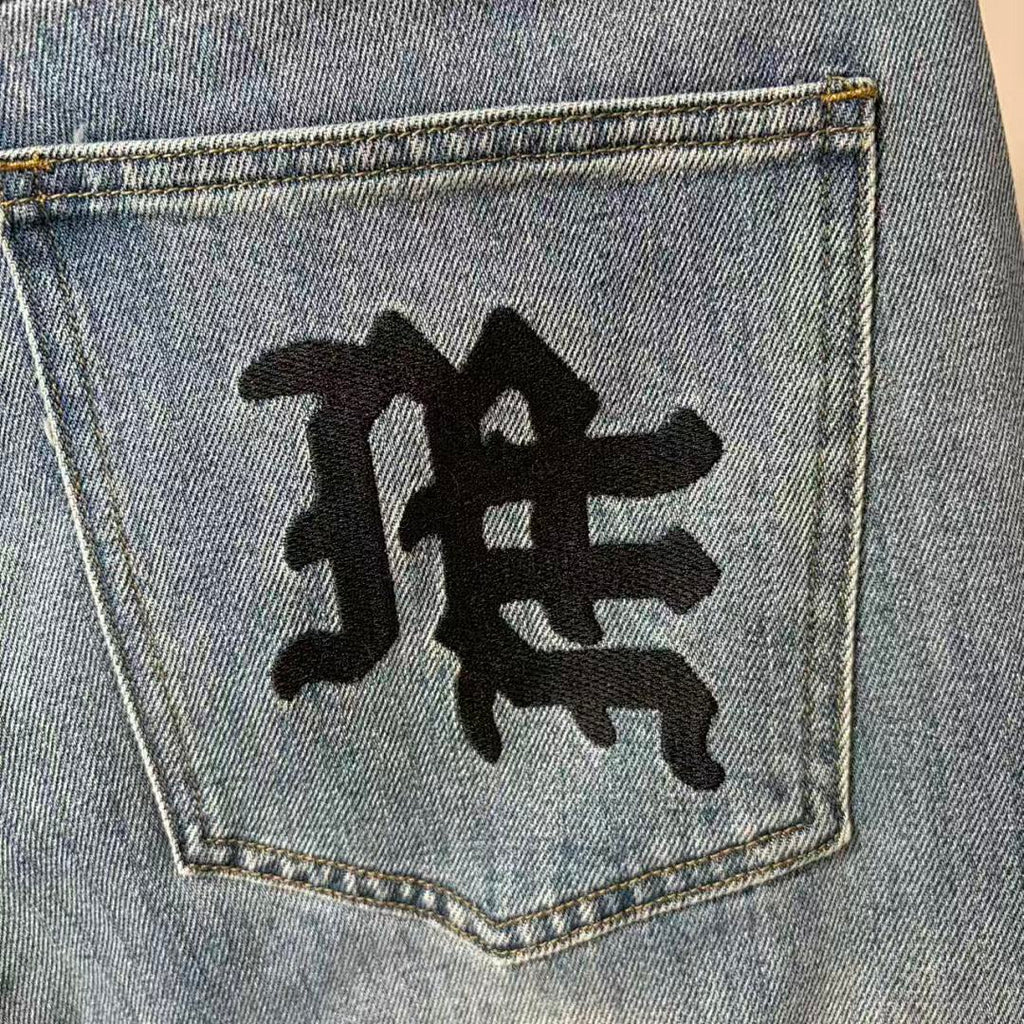 MIXED EMOTION Repeated Letter Side Graphic Jeans