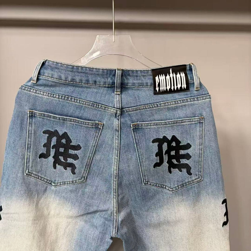 MIXED EMOTION Repeated Letter Side Graphic Jeans