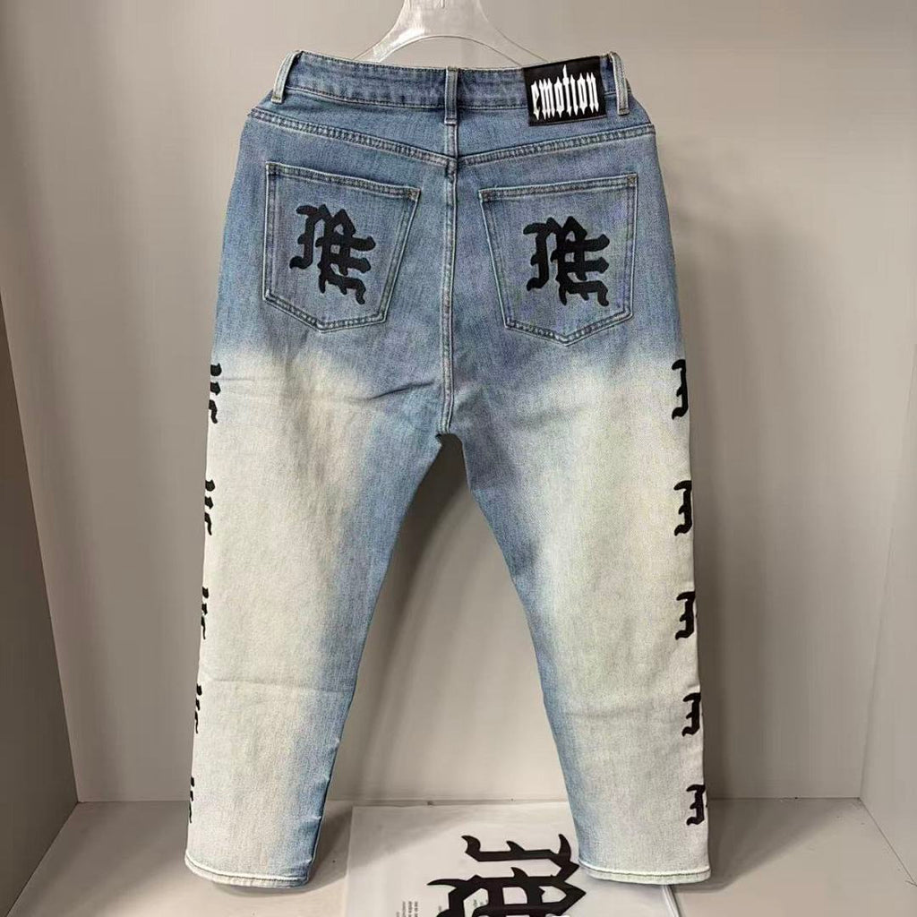 MIXED EMOTION Repeated Letter Side Graphic Jeans